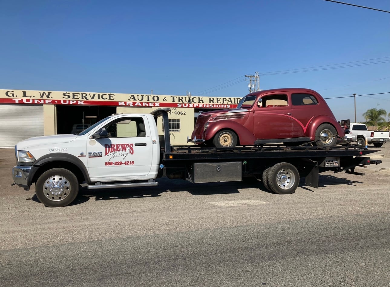 Drew's Towing flatbed truck at service shop